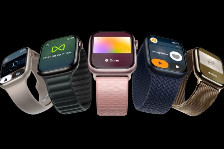 A variety of apple watches on black, pink in the middle